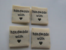 Load image into Gallery viewer, 50 Beige Handmade with (love) heart symbol woven flag labels 2 x 2cm