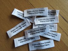 Load image into Gallery viewer, 10 White &quot;Made with New Zealand Merino Wool Fabric&quot; Woven labels 50mm x 10mm