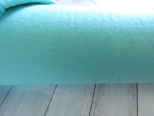 Load image into Gallery viewer, 1.5m Pullton Turquoise 100% merino jersey knit 165g 150cm- available 17 May 2024