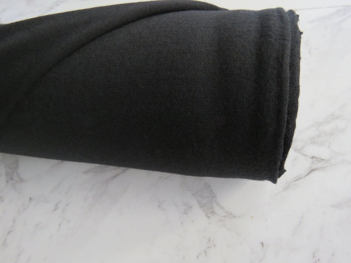 210g black 100% merino jersey knit- one roll available
