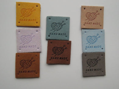 25 Mixed Colour Heart with wool wrapped around  it with knitting needles Hand made PU leather labels. 25 x 25mm