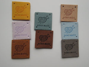 12 Mixed Colour Heart with wool wrapped around  it with knitting needles Hand made PU leather labels. 25 x 25mm
