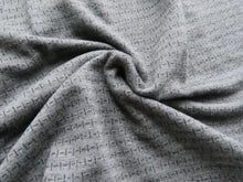 Load image into Gallery viewer, Offcut 16cm L x 128cm W Black Dash and Line print on Charcoal grey 250g 100% merino- precut length
