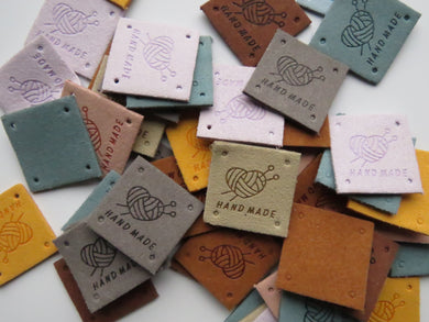 12 Mixed Colour Heart with wool wrapped around  it with knitting needles Hand made PU leather labels. 25 x 25mm