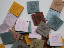 Load image into Gallery viewer, 12 Mixed Colour Heart with wool wrapped around  it with knitting needles Hand made PU leather labels. 25 x 25mm