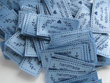 Load image into Gallery viewer, 25 Blue Handmade with Love labels with heart and branch 50mm wide x 25mm high