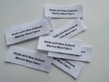 Load image into Gallery viewer, White 100% cotton labels- Made with New Zealand Merino Wool Fabric- sets of 10, 25, 50 or 100