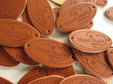 Load image into Gallery viewer, 10 Oval Shape Hand Made with Love &amp; flower and heart PU Leather Labels 30x 10mm