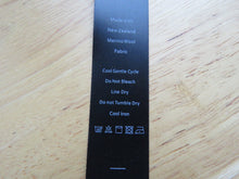 Load image into Gallery viewer, 20 Black Satin washing instructions/ Made with New Zealand Merino wool labels