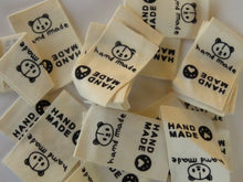Load image into Gallery viewer, 10 Cotton Labels with Bear Print Handmade and/or Bear Paw Handmade labels 25mm wide x 20mm when folded