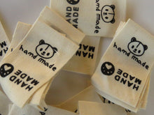 Load image into Gallery viewer, 10 Cotton Labels with Bear Print Handmade and/or Bear Paw Handmade labels 25mm wide x 20mm when folded
