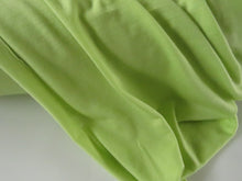 Load image into Gallery viewer, 1.5m Muted Lime Green 195g 100% merino jersey knit 150cm