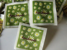 Load image into Gallery viewer, 50 Green Handmade with white folower print Woven Hand Made labels 34mm wide x 34mm high approx.