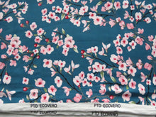 Load image into Gallery viewer, 1m Cherry blossom print on teal background 95% EcoVero viscose with stretch 150cm wide.