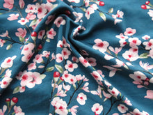 Load image into Gallery viewer, 1m Cherry blossom print on teal background 95% EcoVero viscose with stretch 150cm wide.