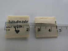 Load image into Gallery viewer, 100 Cream Beige Handmade with (love) heart symbol woven flag labels 2 x 2cm