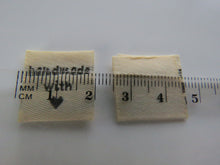 Load image into Gallery viewer, 50 Beige Handmade with (love) heart symbol woven flag labels 2 x 2cm