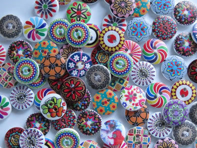 20 mixed print miscellaneous patterns. buttons 15mm 2 holes with white back.