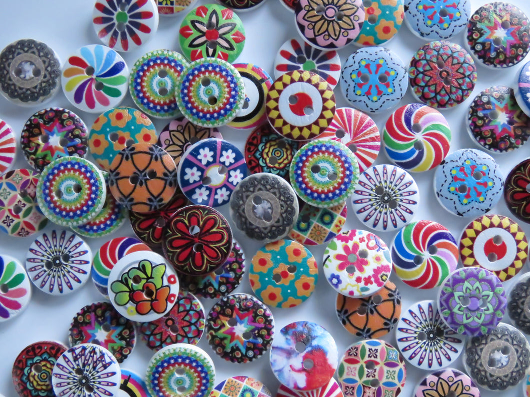 20 mixed print miscellaneous patterns. buttons 15mm 2 holes with white back.