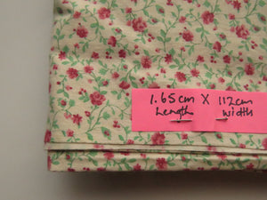 1.65m mini rose print on cream background 100% cotton 112cm wide.