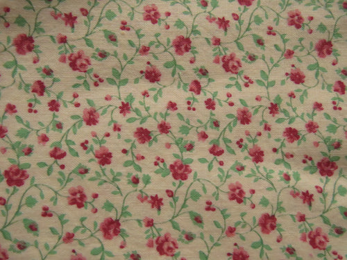 1.65m mini rose print on cream background 100% cotton 112cm wide.