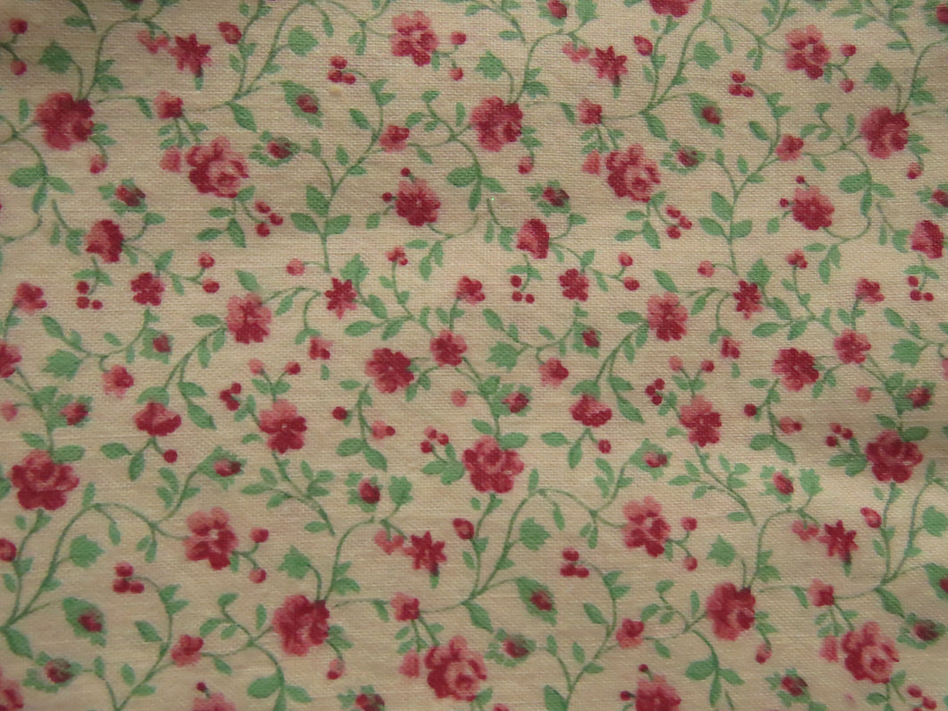 1.65m mini rose print on cream background 100% cotton 112cm wide.