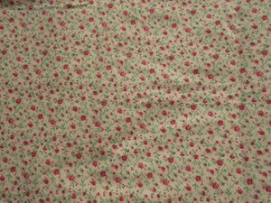 1.65m mini rose print on cream background 100% cotton 112cm wide.