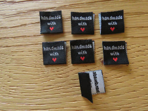 5 Black Handmade with red heart 2 x 2cm satin flag labels.
