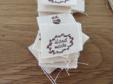 Load image into Gallery viewer, 50 Hand made with a twig leaf border cotton flag labels. 2 x 2cm