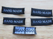 Load image into Gallery viewer, 25 30 x 10mm Hand Made in White Font on Black Woven Labels