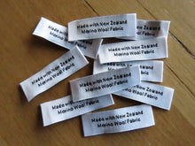 Load image into Gallery viewer, 25 White &quot;Made with New Zealand Merino Wool Fabric&quot; Woven labels 50mm x 10mm