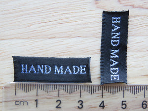 25 30 x 10mm Hand Made in White Font on Black Woven Labels