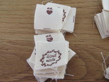 Load image into Gallery viewer, 100 Hand made with a twig leaf border cotton flag labels. 2 x 2cm