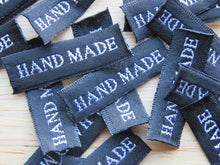 Load image into Gallery viewer, 25 30 x 10mm Hand Made in White Font on Black Woven Labels