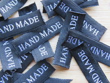 Load image into Gallery viewer, 25 30 x 10mm Hand Made in White Font on Black Woven Labels