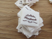 Load image into Gallery viewer, 25 Hand made between tiara  and  fancy scroll cotton flag labels. 2 x 2cm