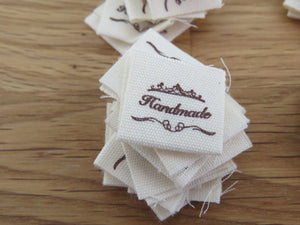25 Hand made between tiara  and  fancy scroll cotton flag labels. 2 x 2cm