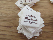 Load image into Gallery viewer, 10 Hand made between tiara  and  fancy scroll cotton flag labels. 2 x 2cm