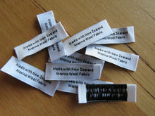 Load image into Gallery viewer, 25 White &quot;Made with New Zealand Merino Wool Fabric&quot; Woven labels 50mm x 10mm