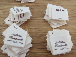 25 Hand made between tiara  and  fancy scroll cotton flag labels. 2 x 2cm