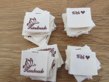 Load image into Gallery viewer, 25 Butterfly Hand made  with heart (love) cotton flag labels. 2 x 2cm
