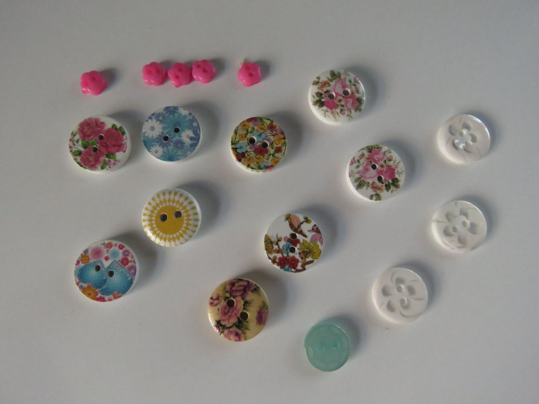 18 Mixed Set Random Buttons- see photos with ruler for sizes. Buttons as shown
