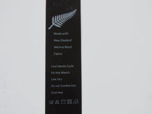 Load image into Gallery viewer, 5 Fern Symbol Black Satin washing instructions/ made with NZ Merino wool labels
