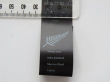 Load image into Gallery viewer, 5 Fern Symbol Black Satin washing instructions/ made with NZ Merino wool labels