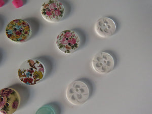 18 Mixed Set Random Buttons- see photos with ruler for sizes. Buttons as shown