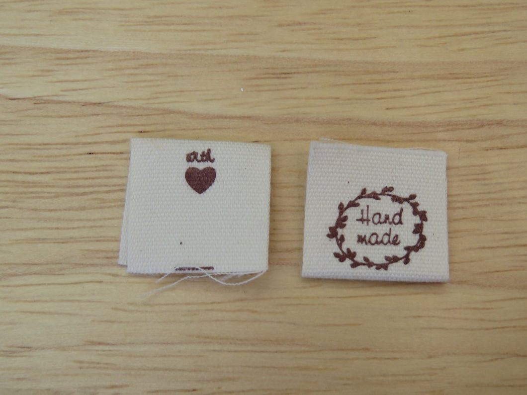 100 Hand made with a twig leaf border cotton flag labels. 2 x 2cm