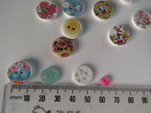 18 Mixed Set Random Buttons- see photos with ruler for sizes. Buttons as shown