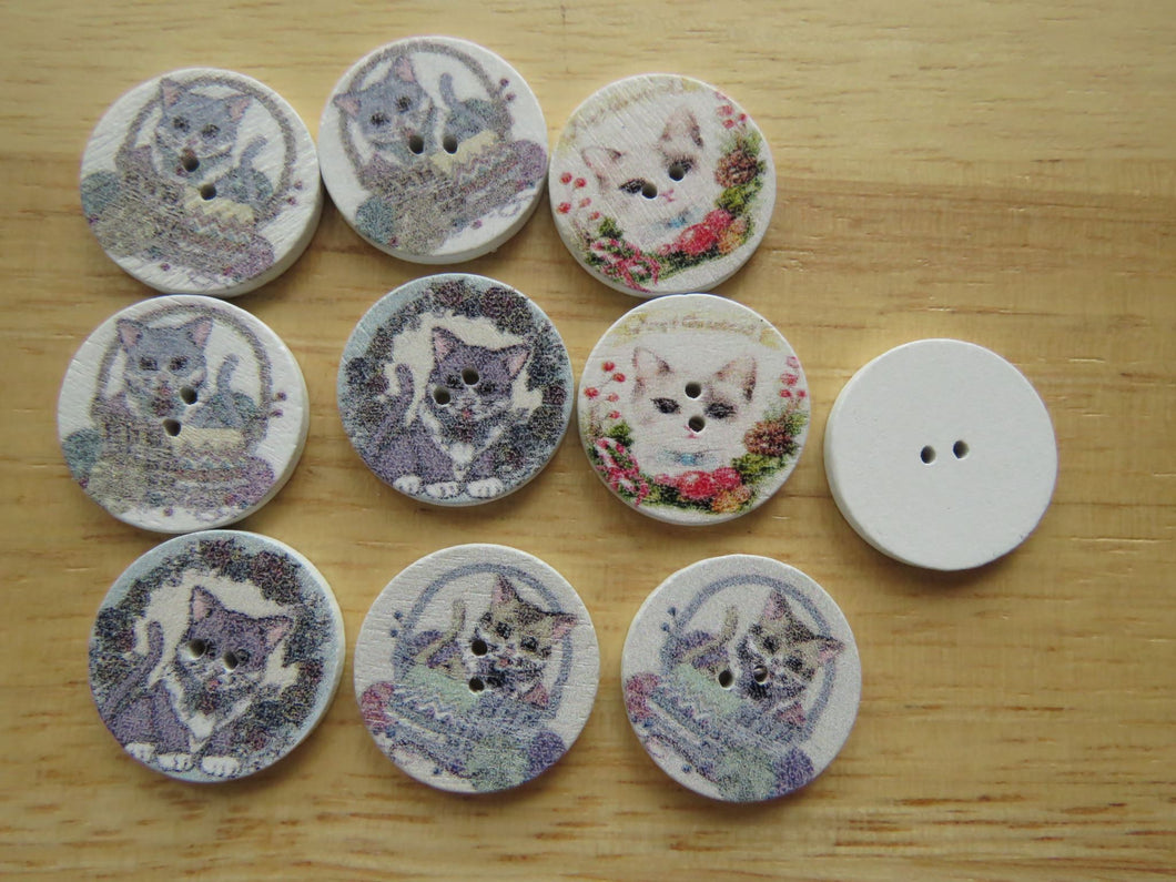 10 Cat in a basket or amongst flowers 20mm buttons white back 2 holes