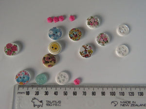 18 Mixed Set Random Buttons- see photos with ruler for sizes. Buttons as shown