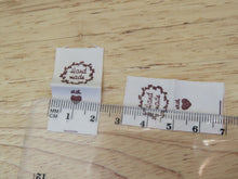 Load image into Gallery viewer, 100 Hand made with a twig leaf border cotton flag labels. 2 x 2cm